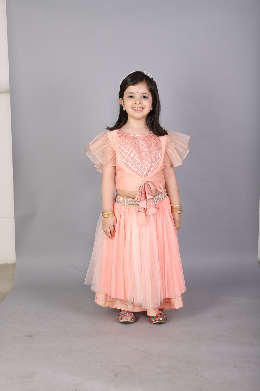 PEACH FRILLY TOP WITH DOUBLE LAYERED NET LEHENGA