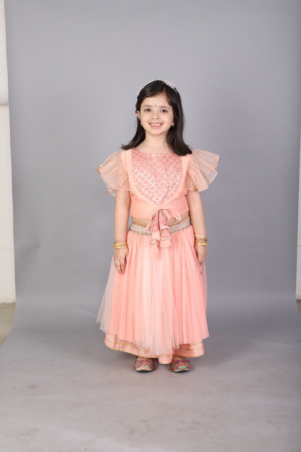 PEACH FRILLY TOP WITH DOUBLE LAYERED NET LEHENGA