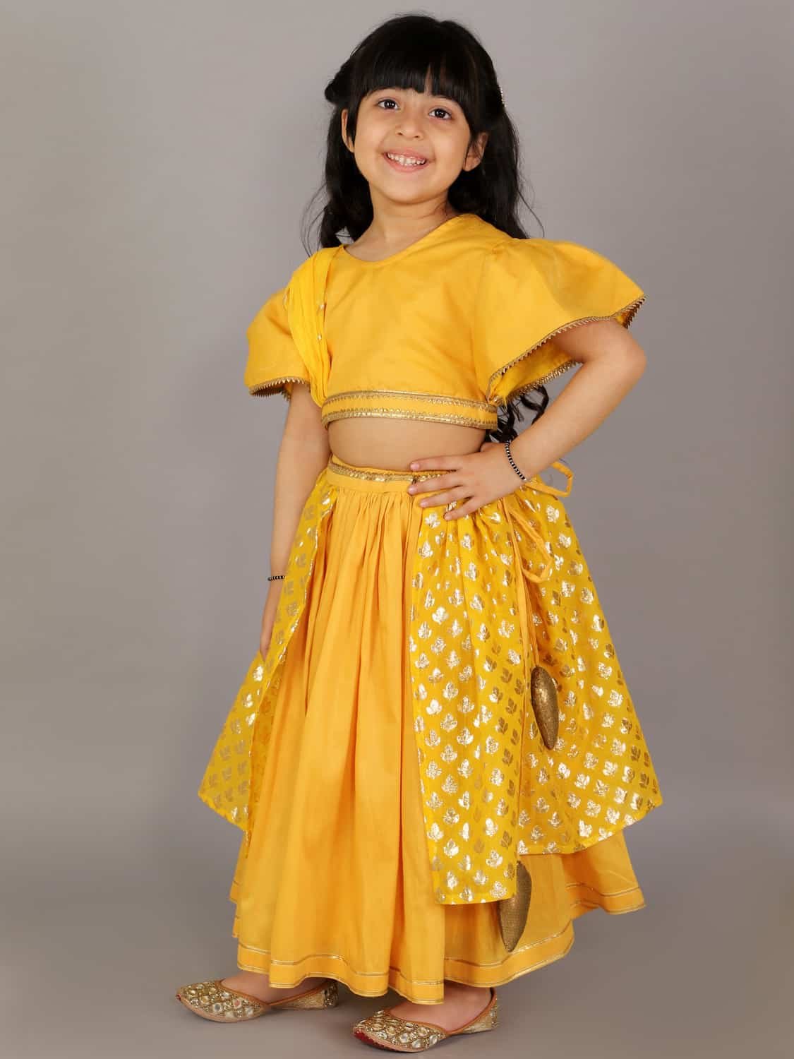 MUSTARD BLOUSE WITH ATTACHED NET DUPATTA AND DOUBLE LAYERED LEHENGA