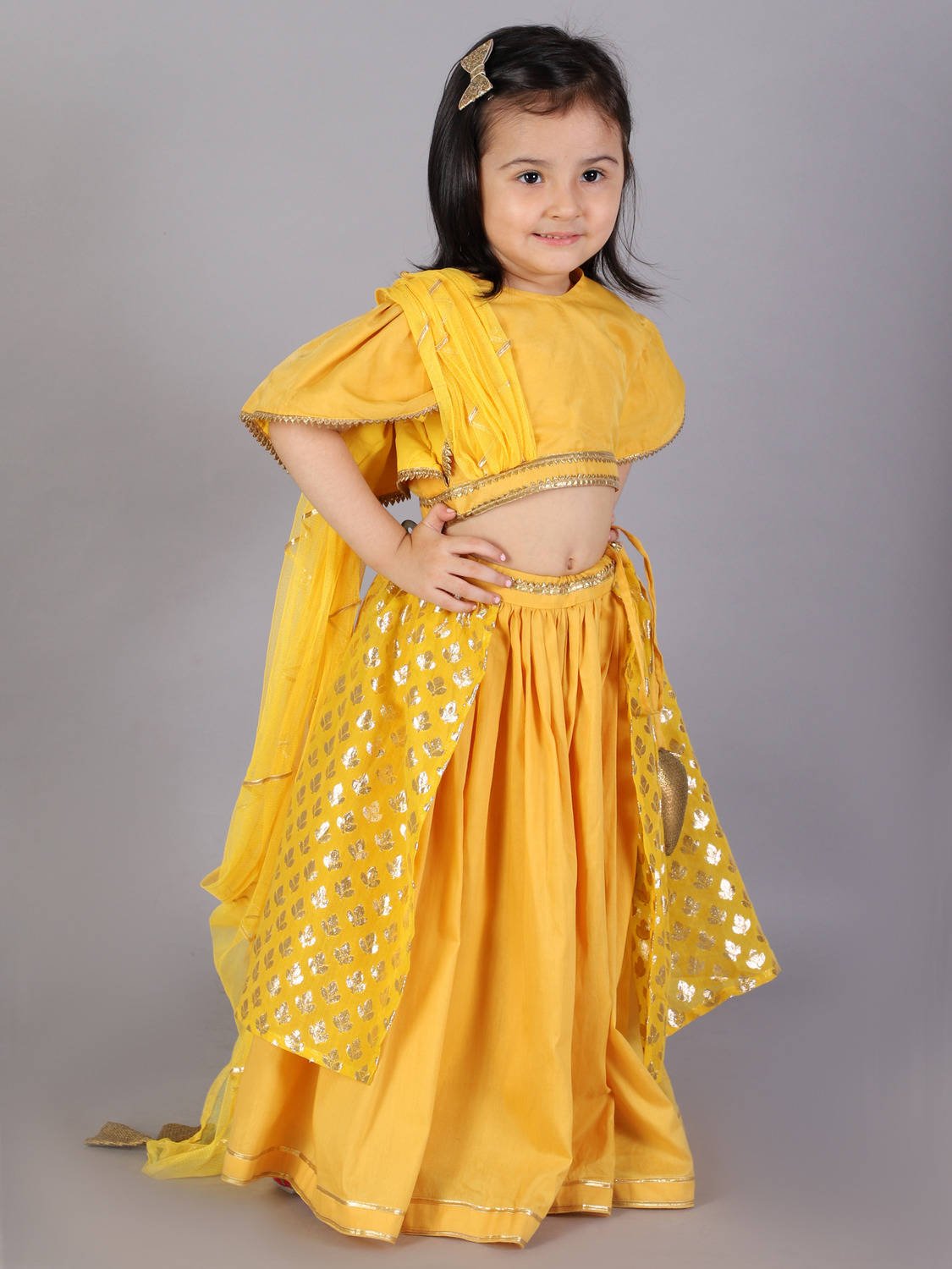 MUSTARD BLOUSE WITH ATTACHED NET DUPATTA AND DOUBLE LAYERED LEHENGA