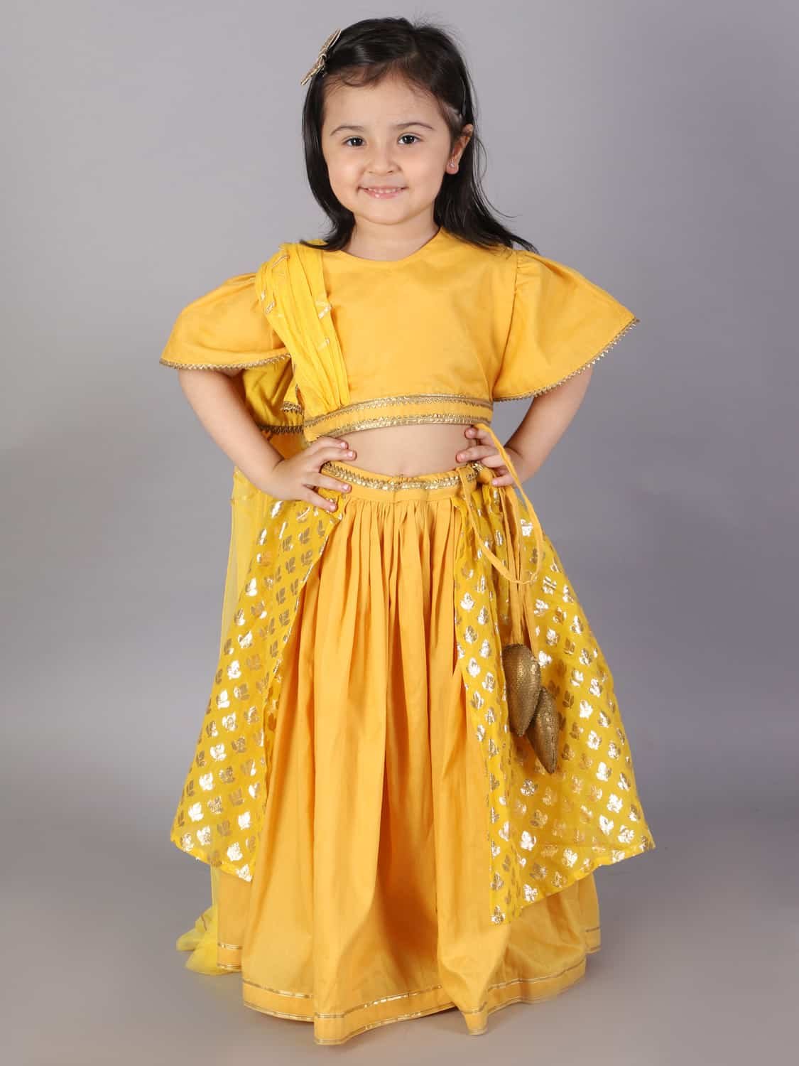 MUSTARD BLOUSE WITH ATTACHED NET DUPATTA AND DOUBLE LAYERED LEHENGA