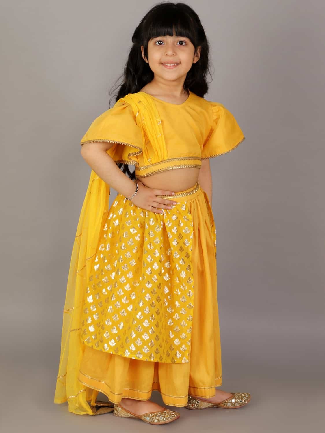 MUSTARD BLOUSE WITH ATTACHED NET DUPATTA AND DOUBLE LAYERED LEHENGA