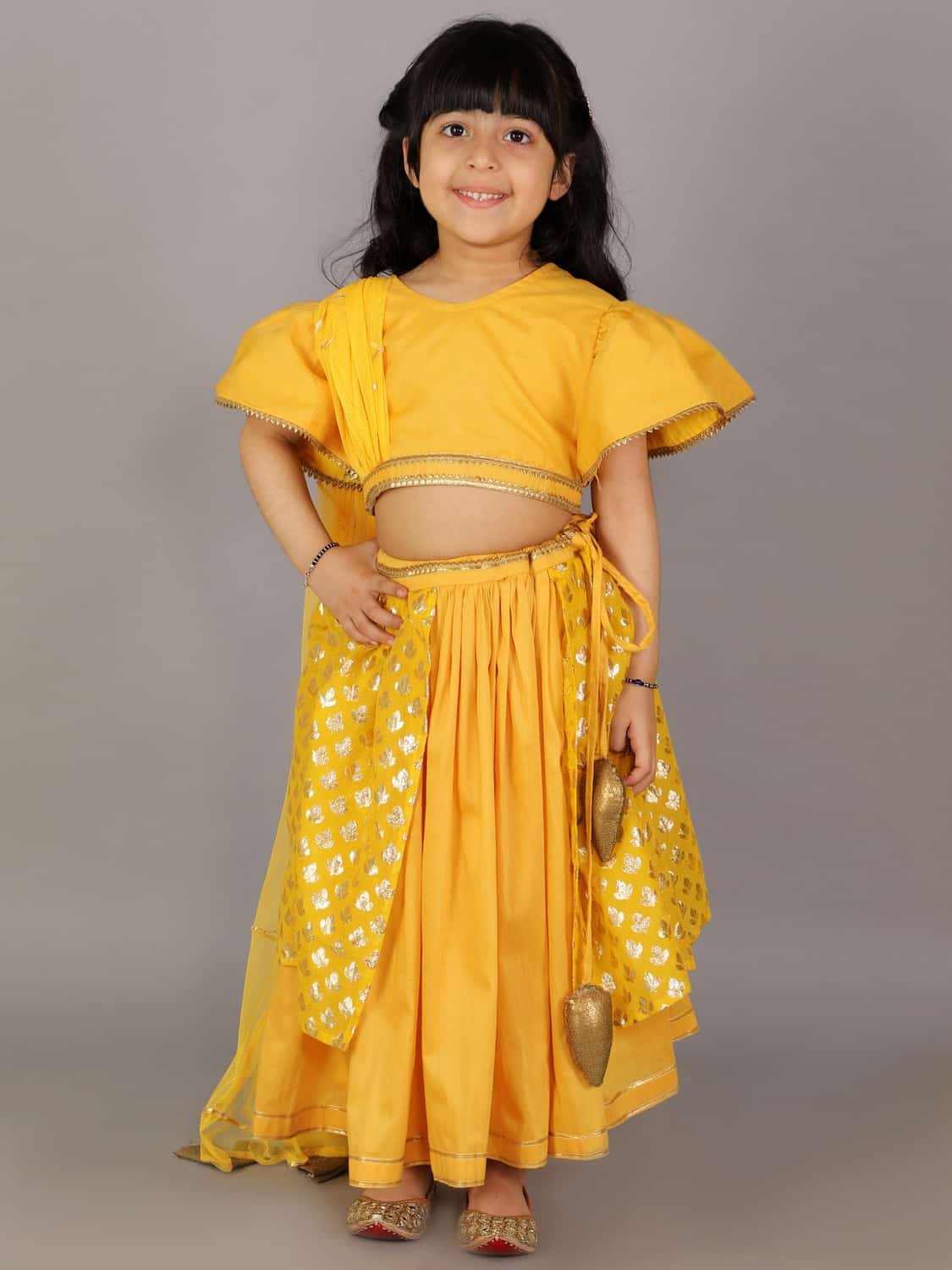 MUSTARD BLOUSE WITH ATTACHED NET DUPATTA AND DOUBLE LAYERED LEHENGA